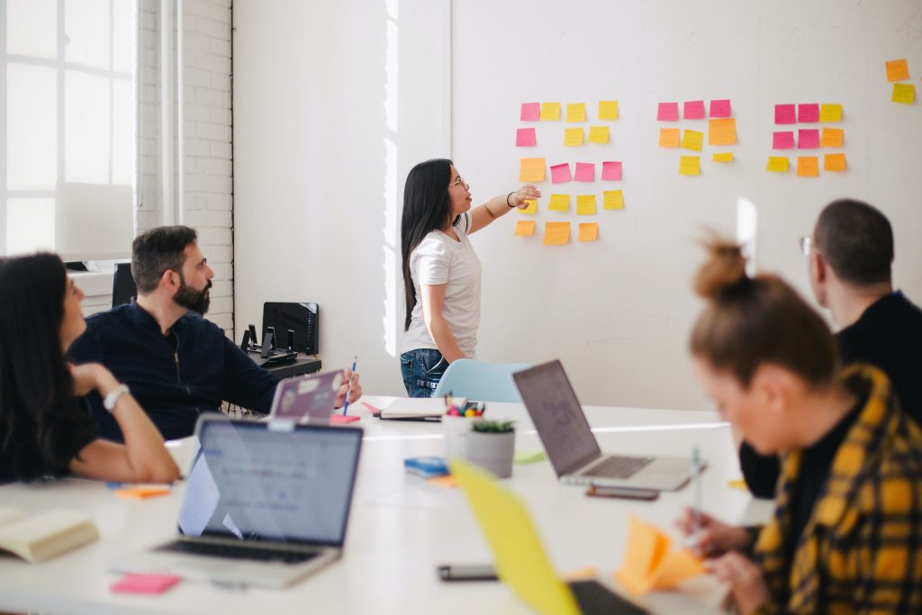 A team brainstorming in a conference room about building a brand that attracts top talent